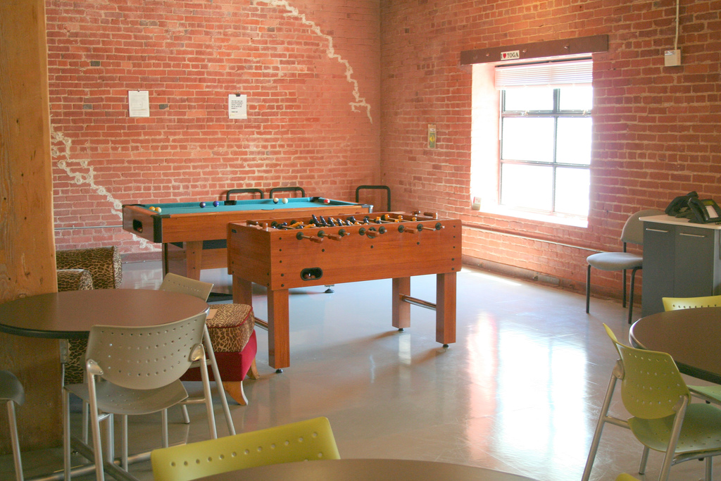 break room with foosball table and pool