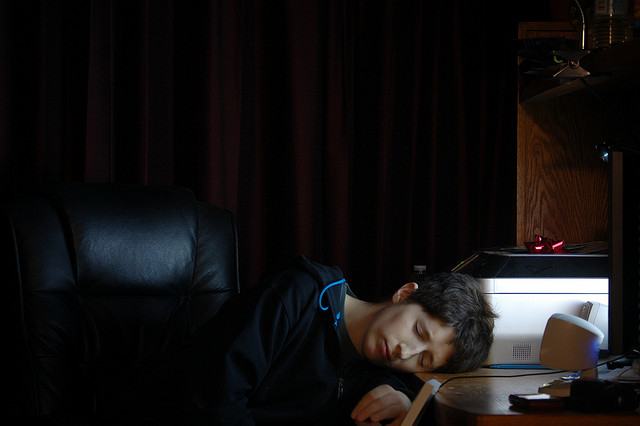 woman sleeping at her desk