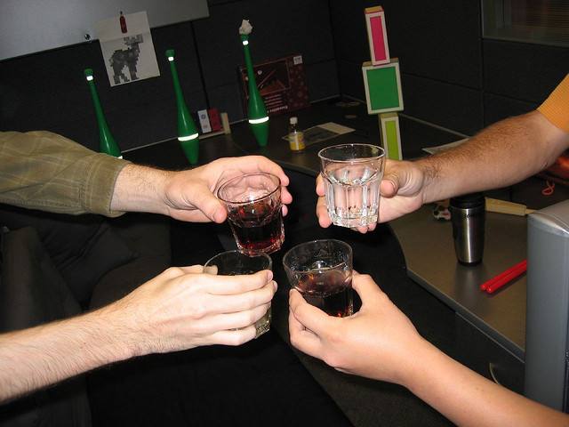 coworkers toasting glasses