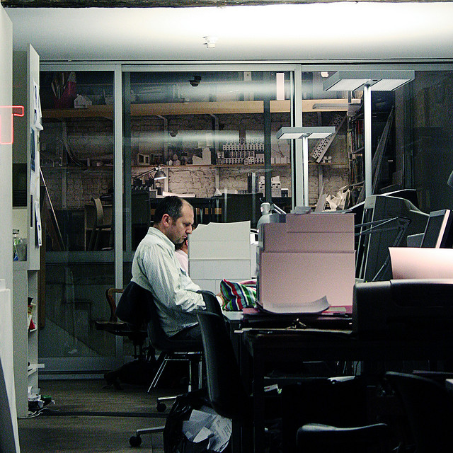working overtime in dark office