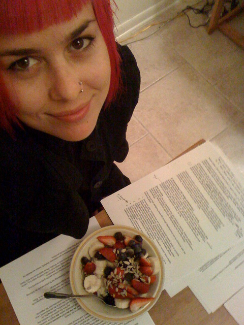 girl working with a bowl of fruit