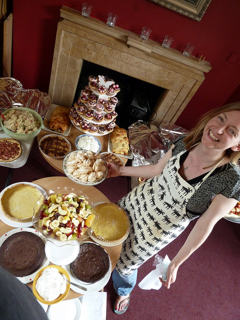 office catering table with admin assistant in apron