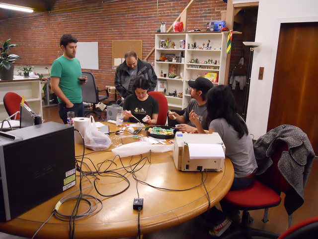 Coworkers eating sushi together