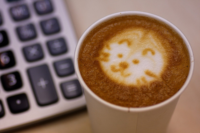 latte art next to calculator