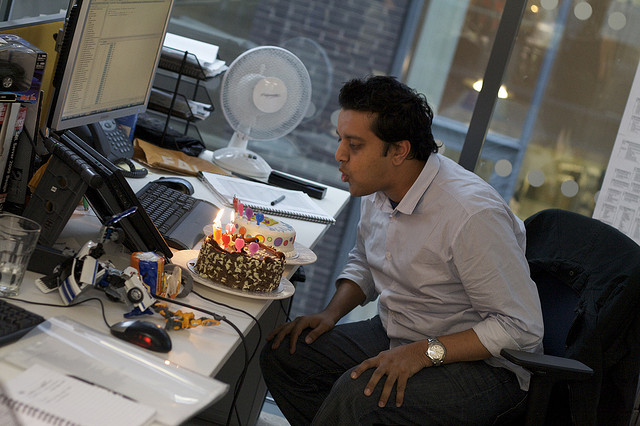 employee with birthday cake