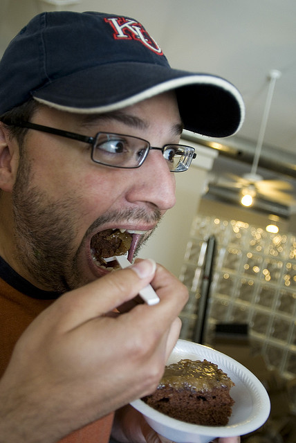 coworker eating birthday cake
