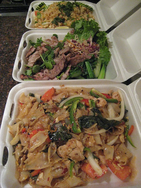 row of Thai takeout boxes