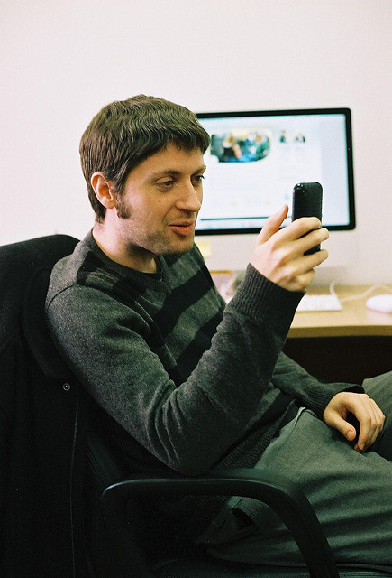 man on smartphone at the office