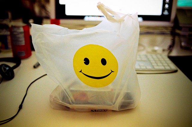 takeout bag with smiley face