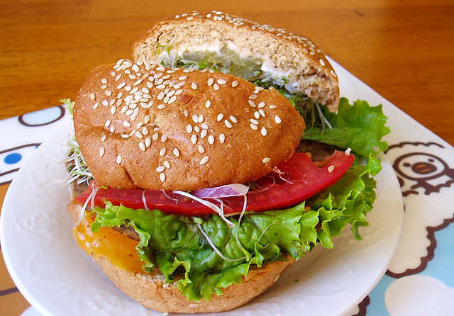 sandwich with veggies on a whole wheat bun