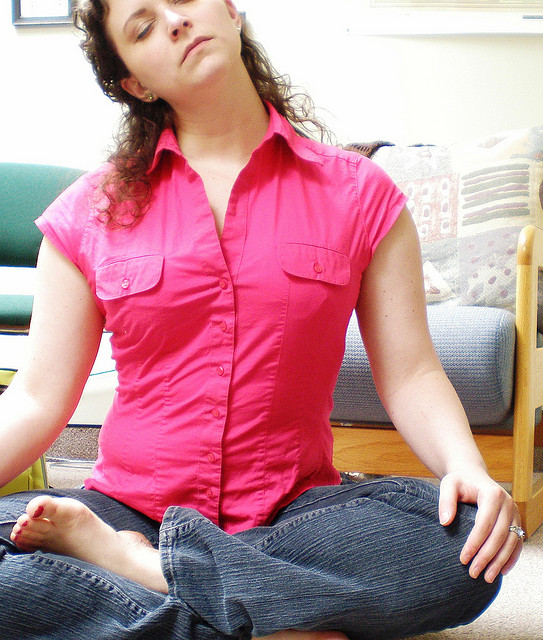 woman doing yoga at the office