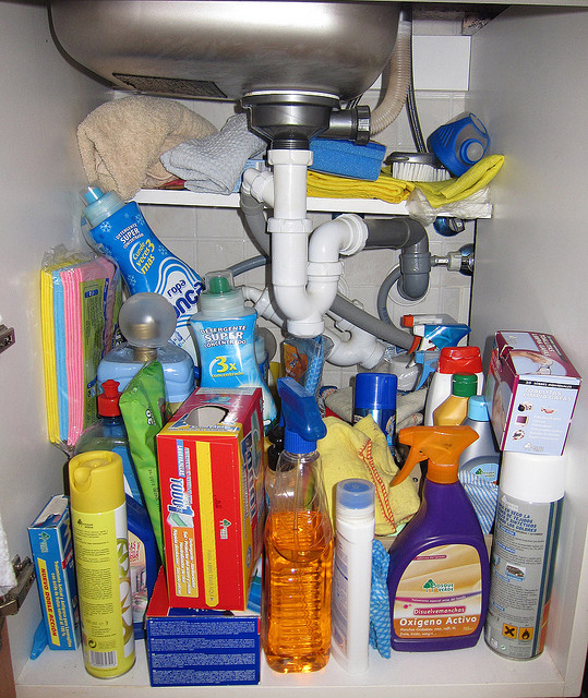 messy cleaning supply cabinet