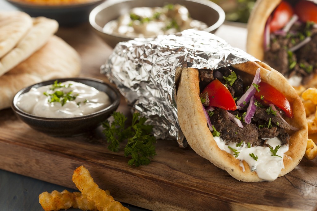 Homemade Meat Gyro with Tzatziki Sauce, tomatos and French Fries